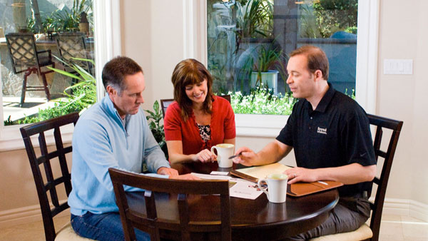 Image of a pair of customers getting their in-home window placement consultation with a specialist at Renewal by Andersen in Sacramento, CA